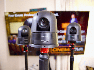Two PTZ cameras covering corporate panel discussion